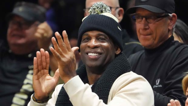 Colorado football coach Deion Sanders attends a men’s basketball game.